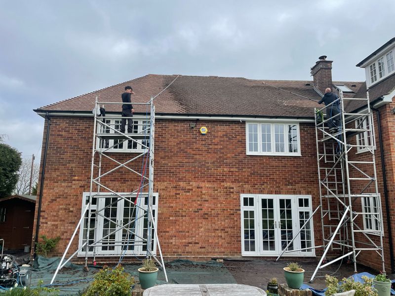 Roof cleaning carried out safely from scaffold towers by The Roof Moss Cleaners in Stevenage
